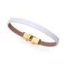 Pulsera de acero Ip dorado con piel blanca